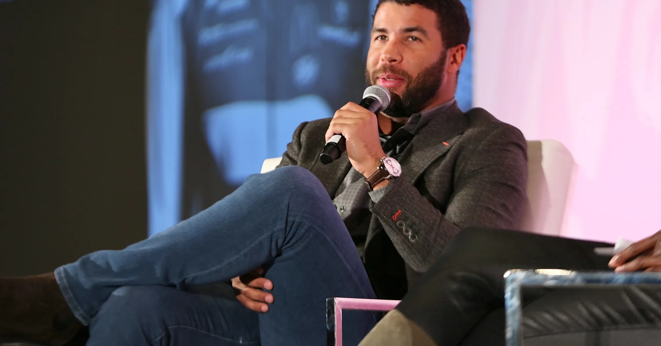 Bubba Wallace Unveils Space Jam Race Suit and Helmet